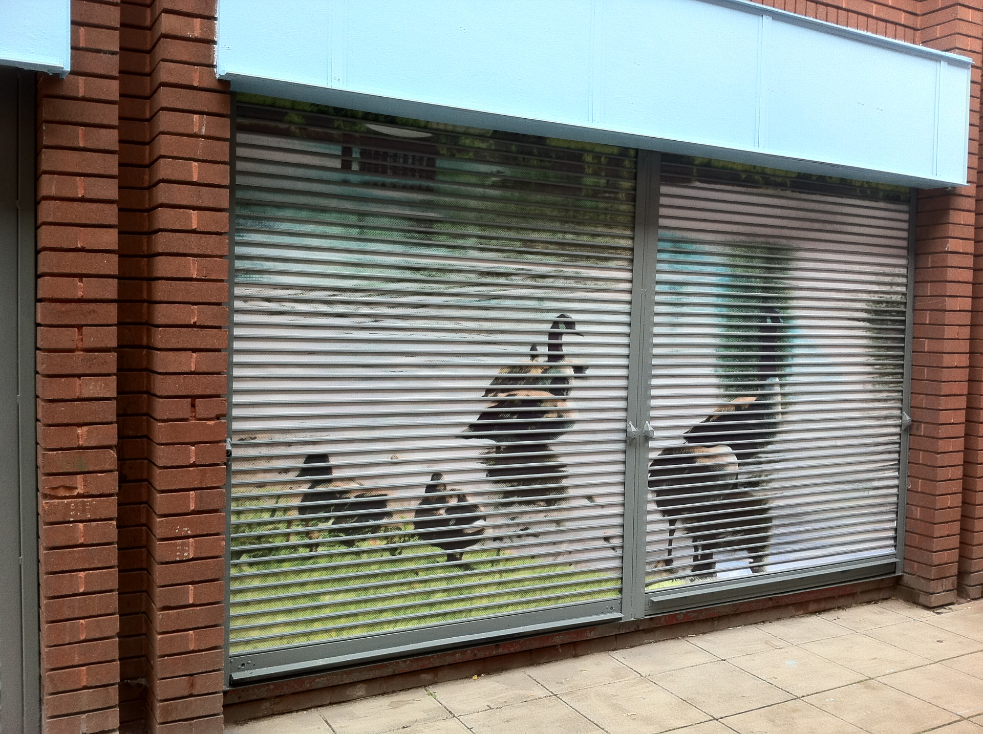 Roller shutter vinyl advertising a local business overnight designed, printed and installed by Shutter Media in Darlington.