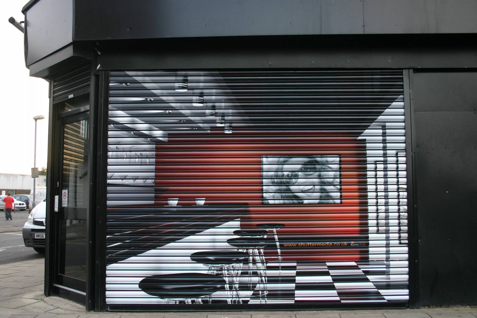 Printed roller shutter graphics on a retail shopfront designed, printed and installed by Shutter Media in Middlesbrough.