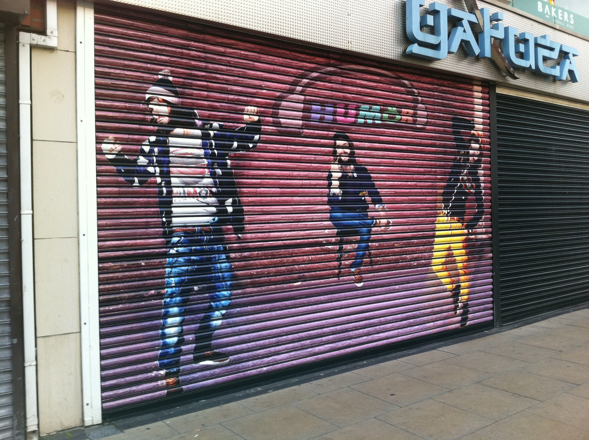Commercial roller shutter graphics on a corner unit designed, printed and installed by Shutter Media in the North East.
