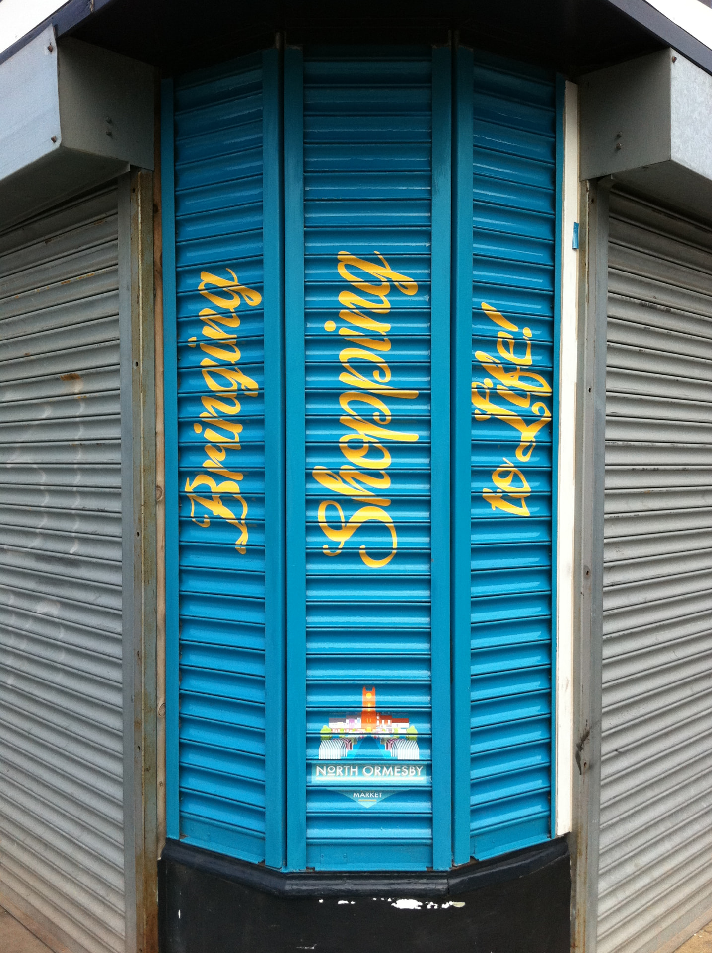Printed roller shutter advertising a food and drink brand designed, printed and installed by Shutter Media in Newcastle upon Tyne.