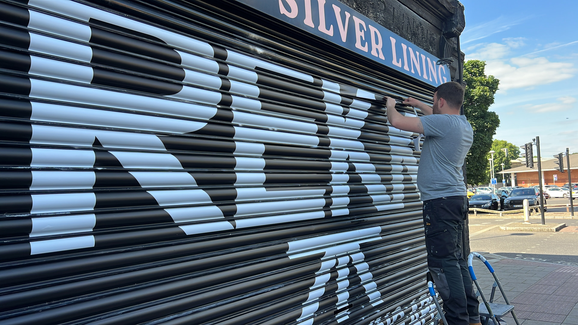 Roller shutter vinyl advertising a local business overnight designed, printed and installed by Shutter Media in Darlington.
